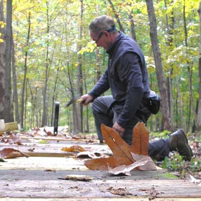 Mark Petnuch repairs a boardwalk at Thorn Creek Nature Preserve.
